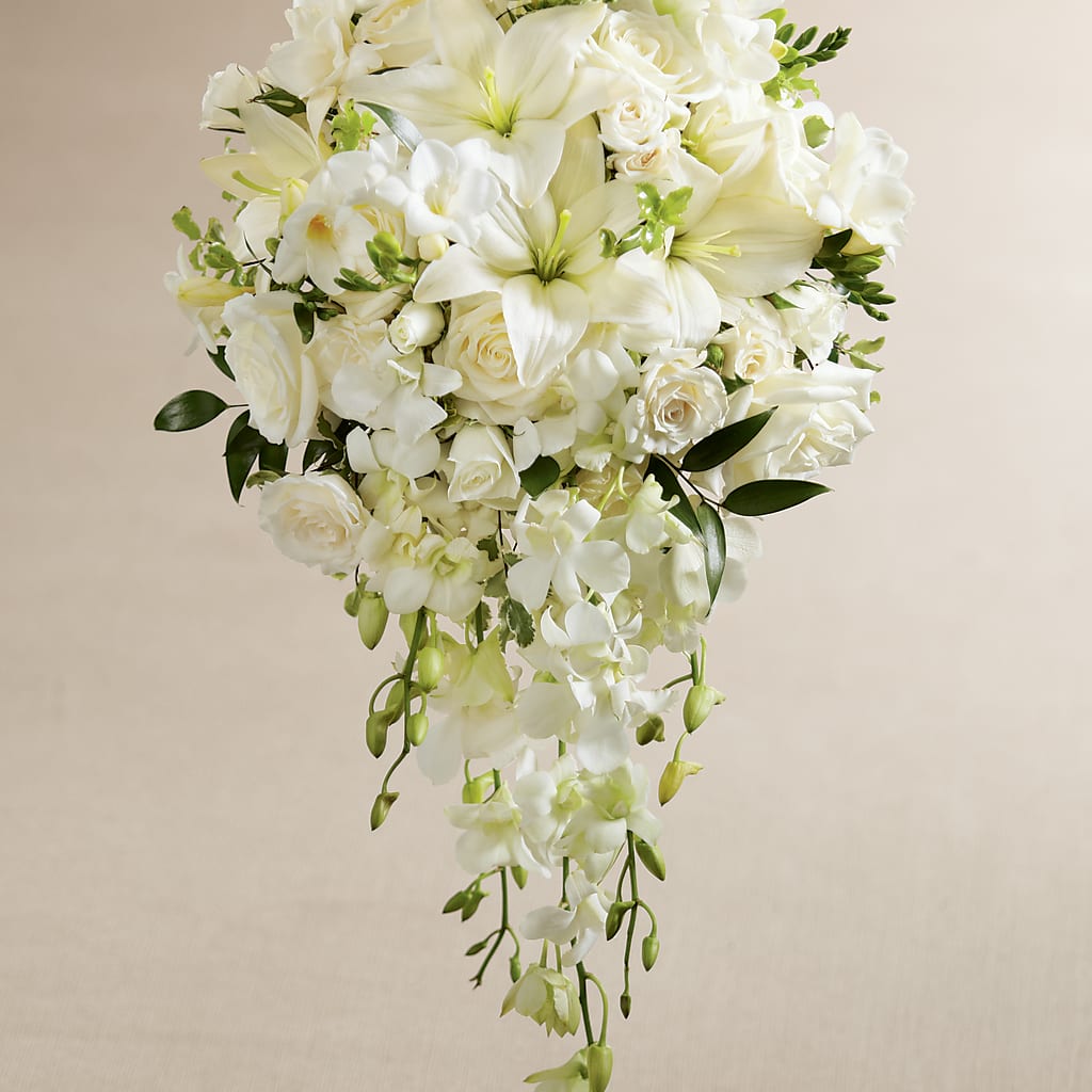 orchid and lily flower arrangement White Wonders Bouquet